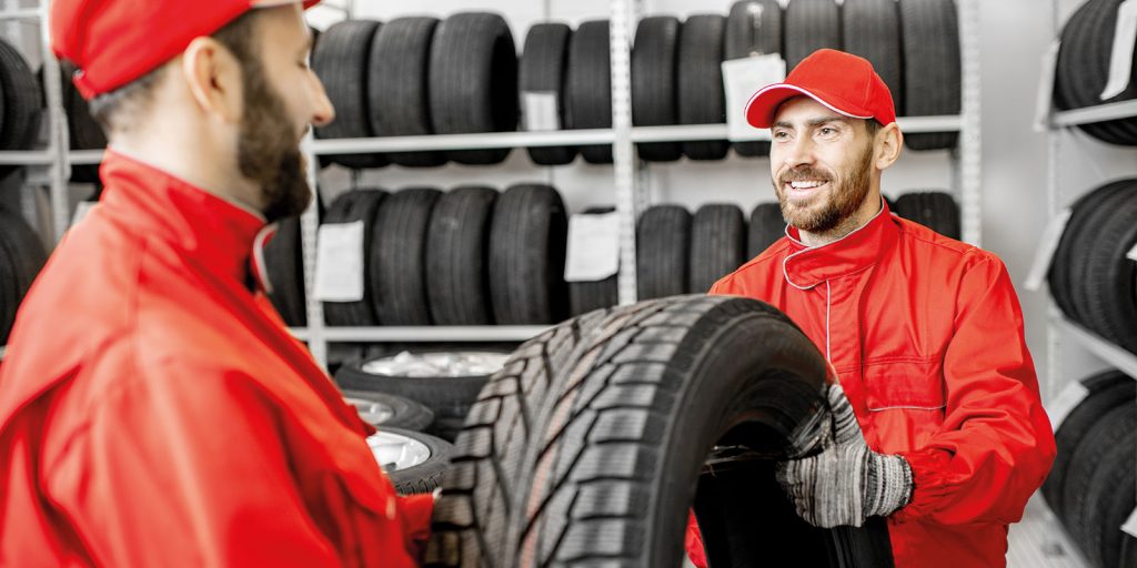 Men working in the warehouse with tires 2022 01 19 00 27 19 utc