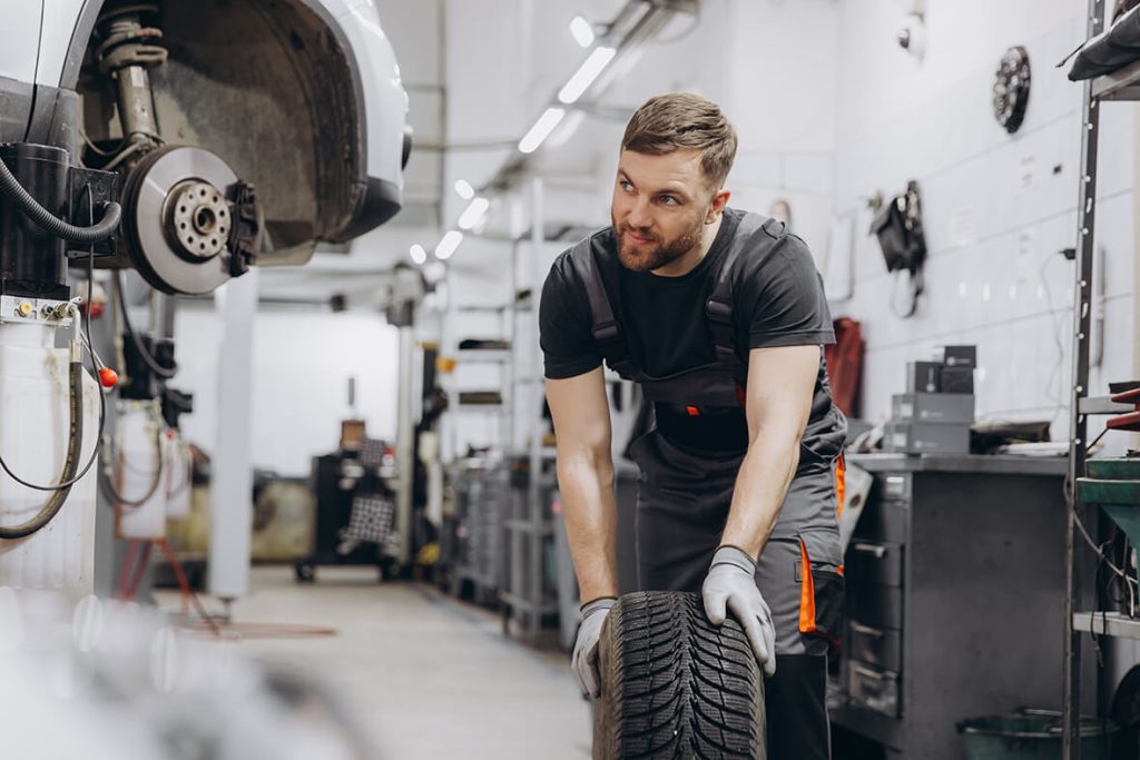 happy smiling car mechanic working in garage and c 2024 06 03 23 12 21 utc